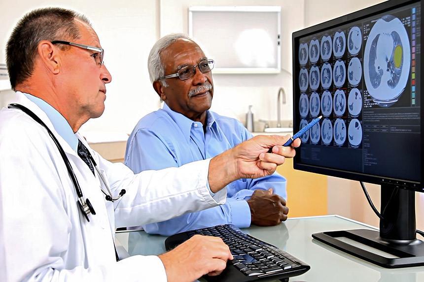 Doctor examining MRI of the misaligned Atlas