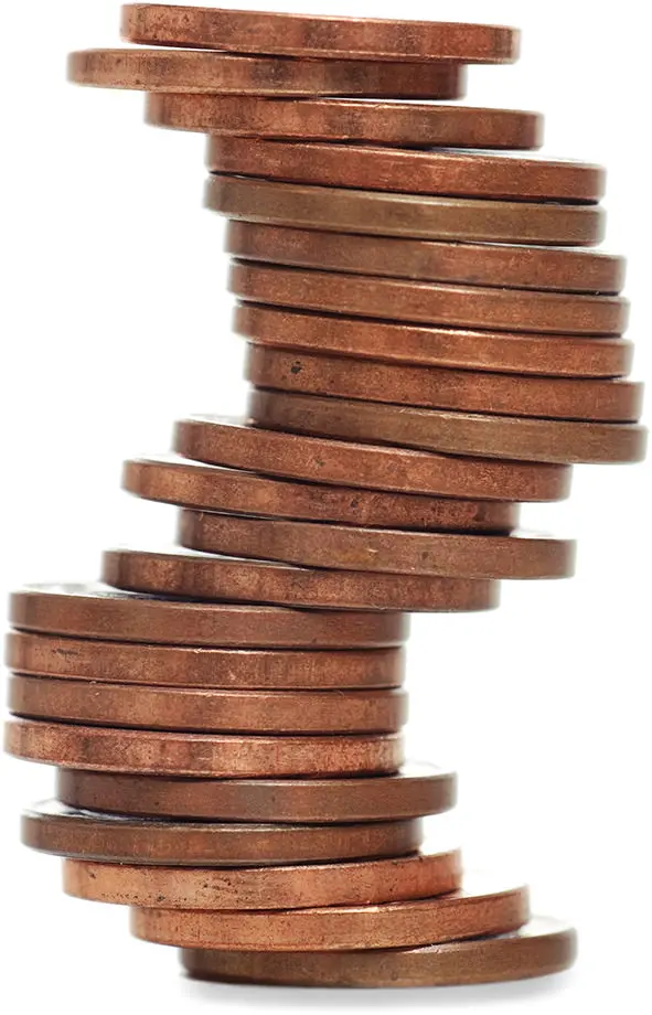 Misaligned coins representing poor posture and back pain Misaligned coins representing poor posture and back pain